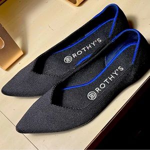 Rothy’s Pointed Flats. Black with blue accents.